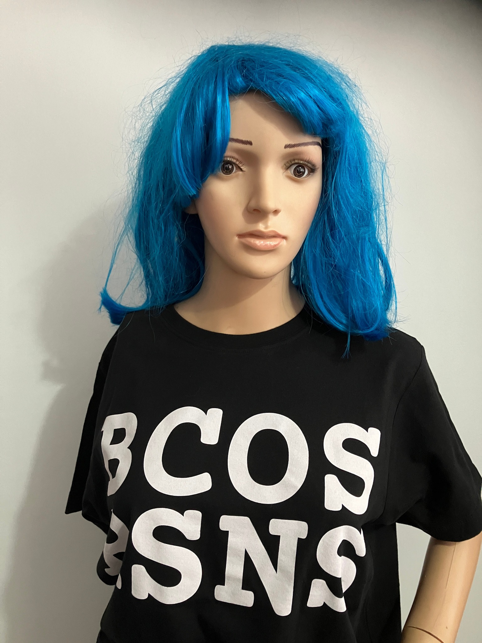 A mannequin wearing a white-on-black BCOS RSNS logo t-shirt